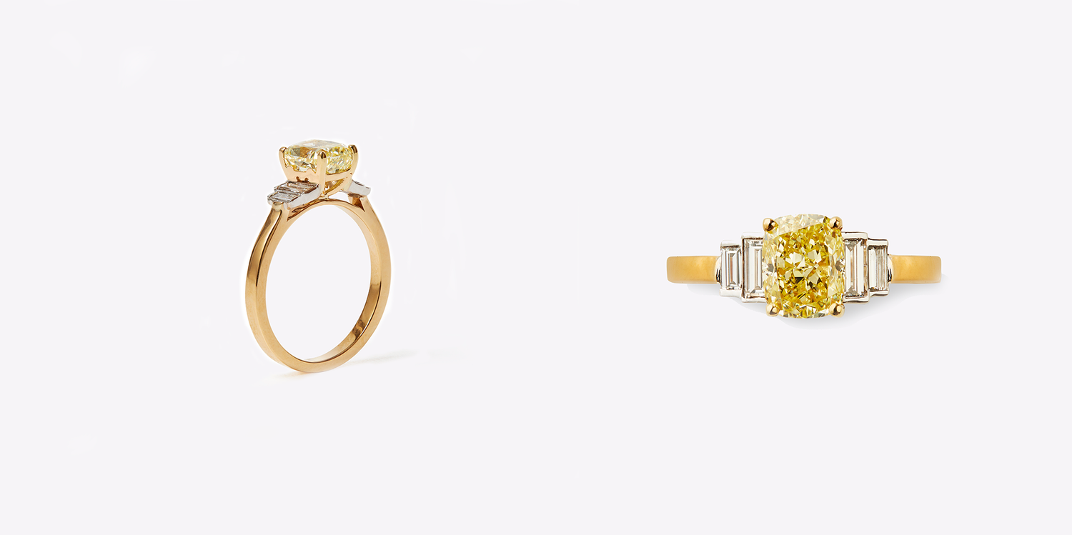 bespoke engagement rings London, yellow diamond with four baguette diamond on either side in 18k yellow gold and a special bear motif peering over the baguette diamond
