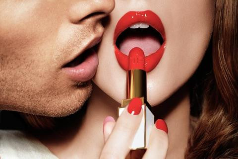 photo of lips putting on red lipstick and a man kissing her