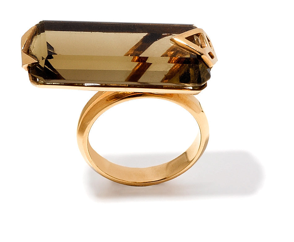 bespoke smoky topaz and geometric 18k yellow gold setting that crosses two fingers.