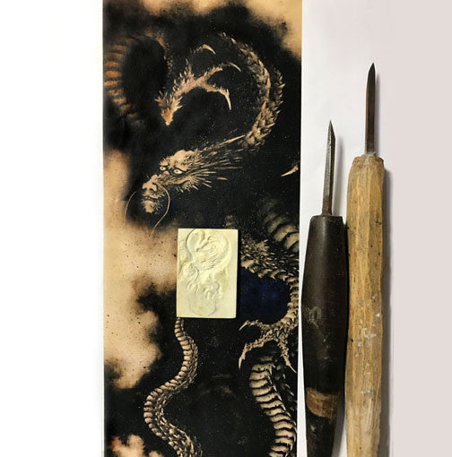 Hokusai's dragon and the hand carved tools and bone carving