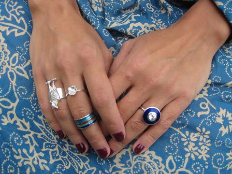 Marta Abbat wearing the aurora diamond ring, bat and cherry blossom ring