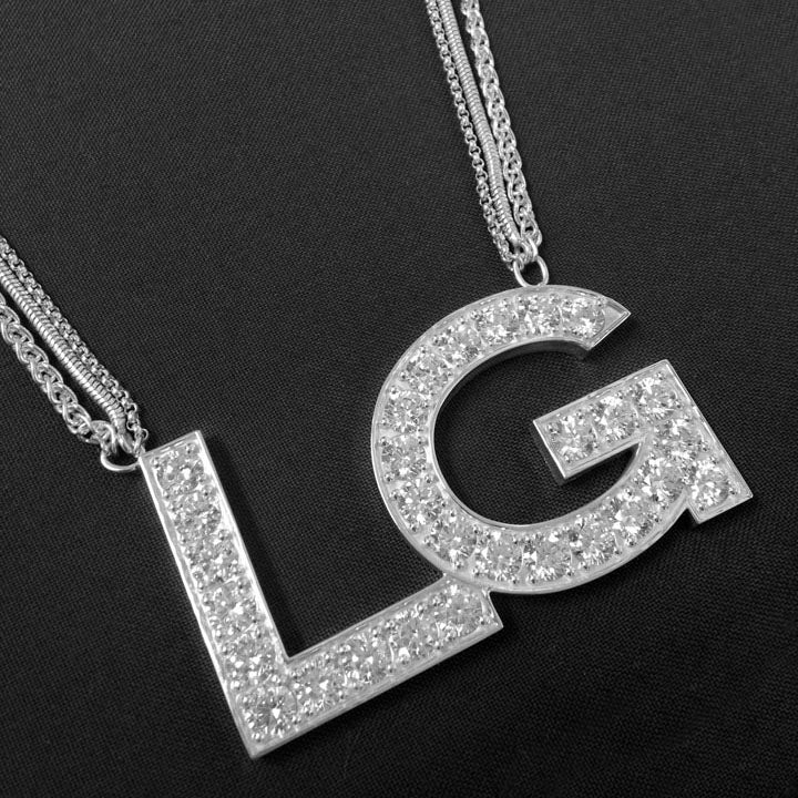 Custom Lady Gaga necklace with LG and CZ stones set in the letters for the G.U.Y video