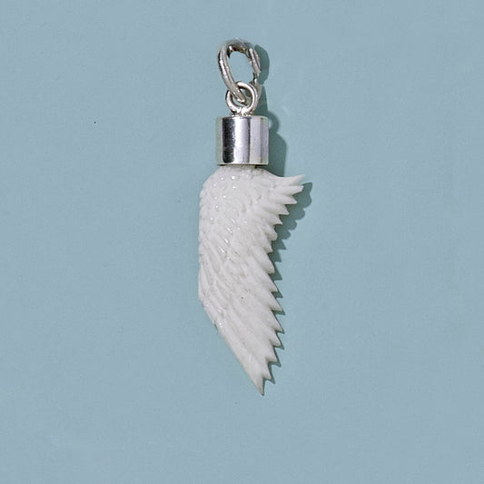 Small Hand Carved Recycled  Bone Wing with Silver Cap